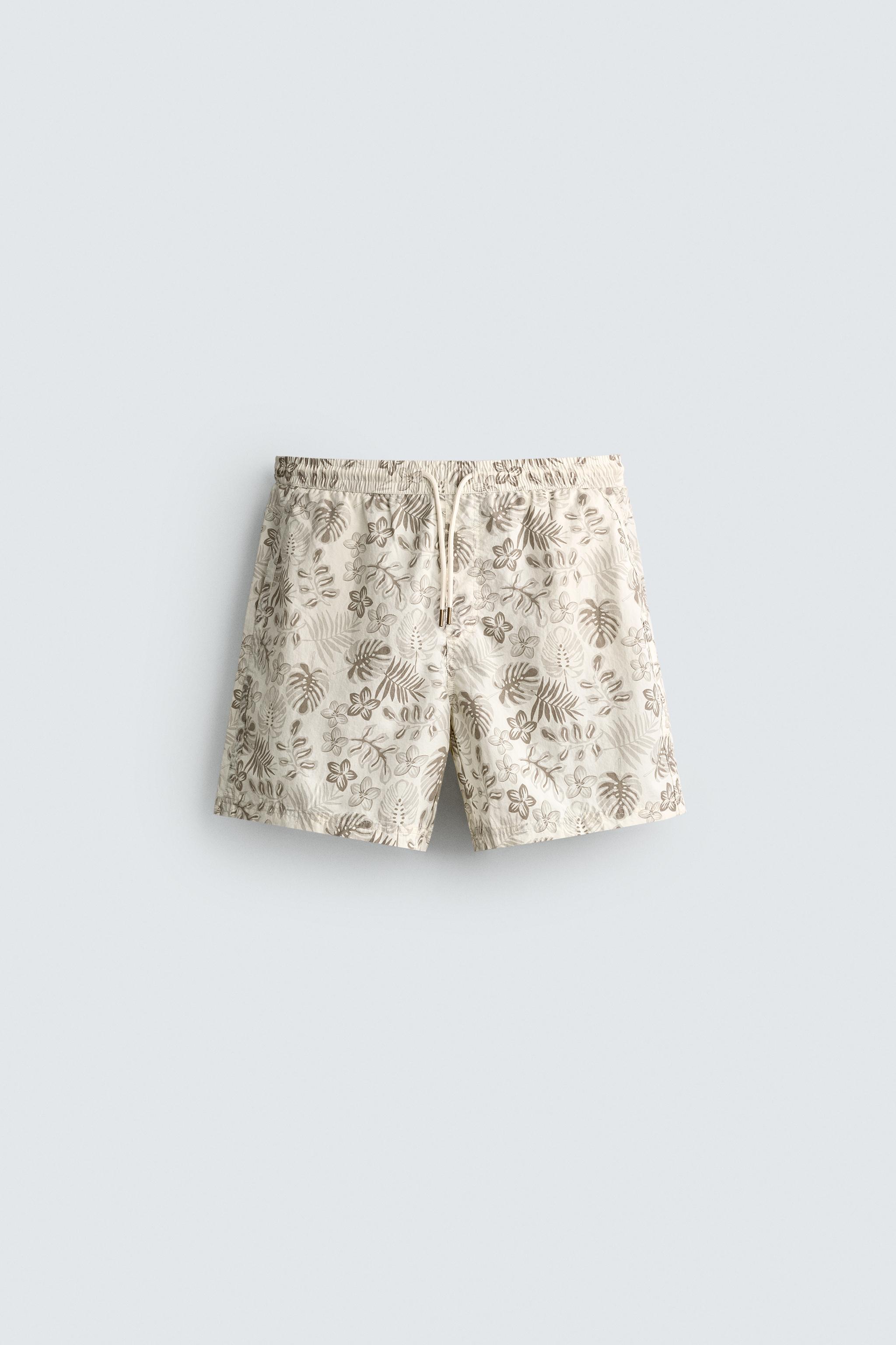 LONG FLORAL PRINT SWIM SHORTS